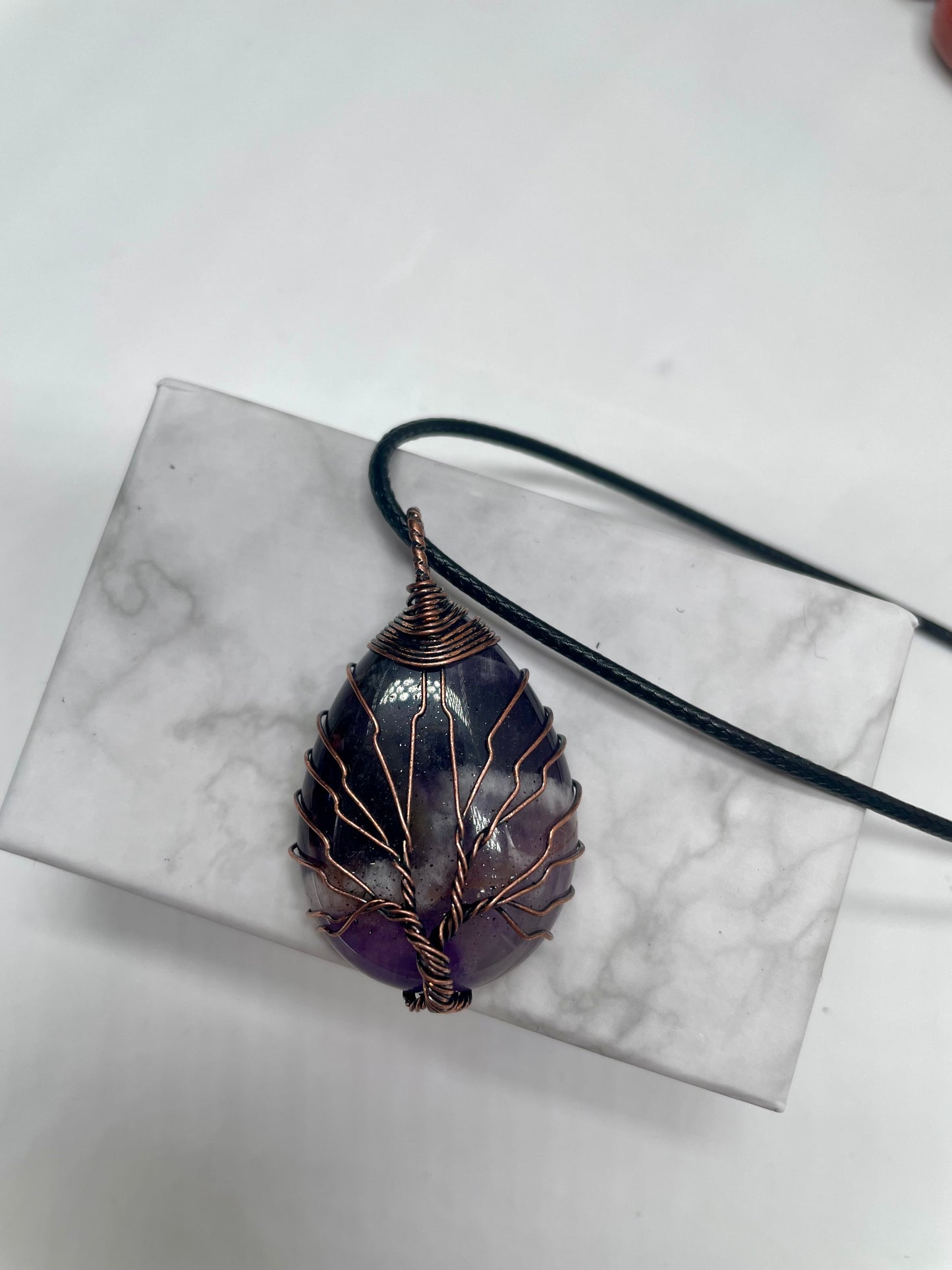 Pendente in ametista con venature in rame